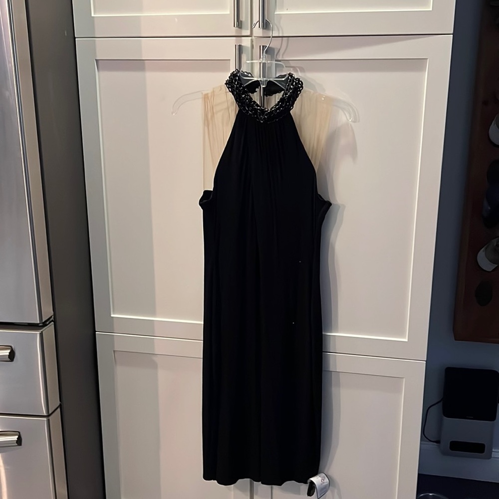 Bailey44 black dress w chain detailing at neck.